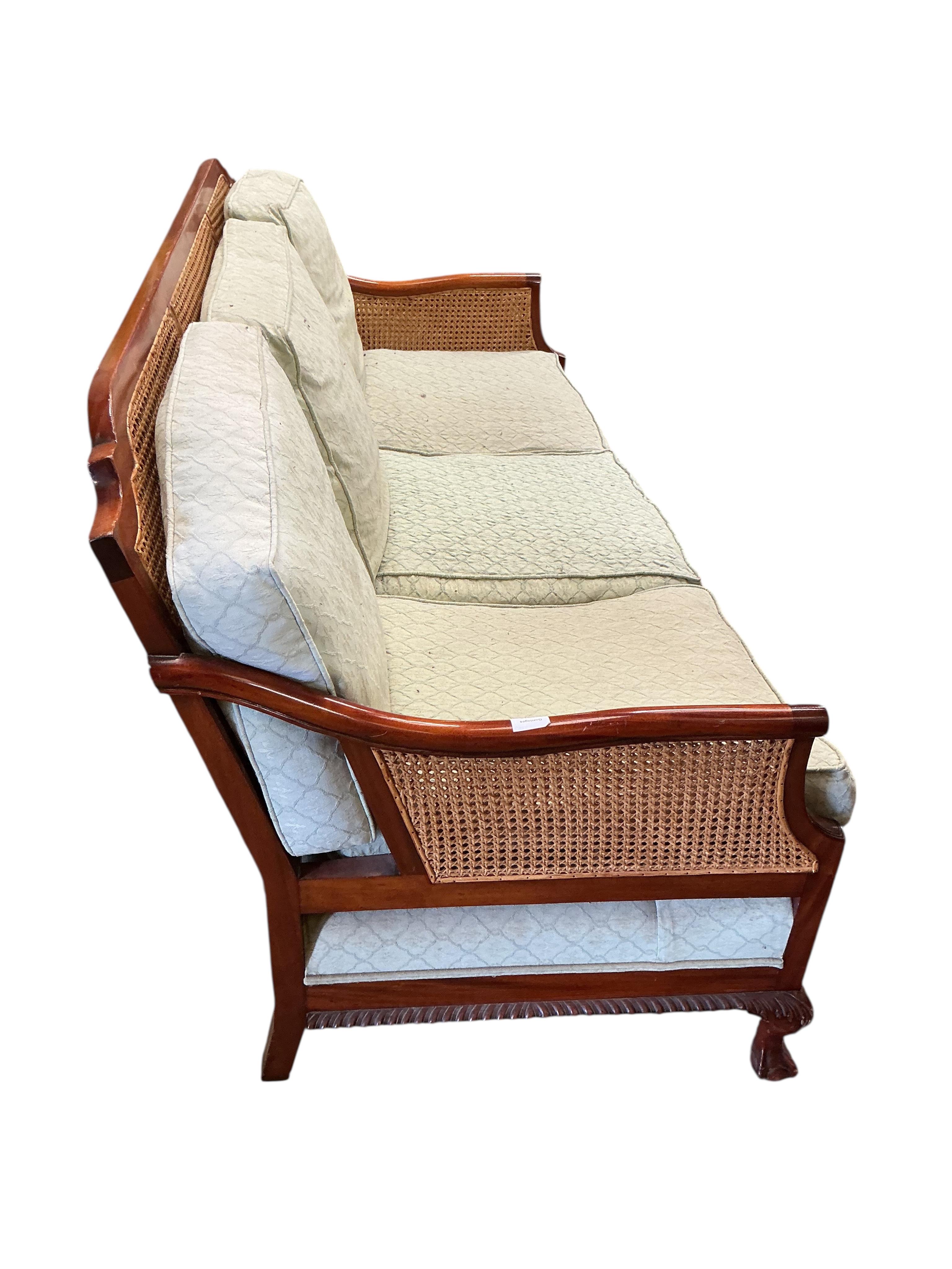 A mahogany double caned bergere settee with loose cushion seat and back, width 178cm, depth 78cm, height 87cm